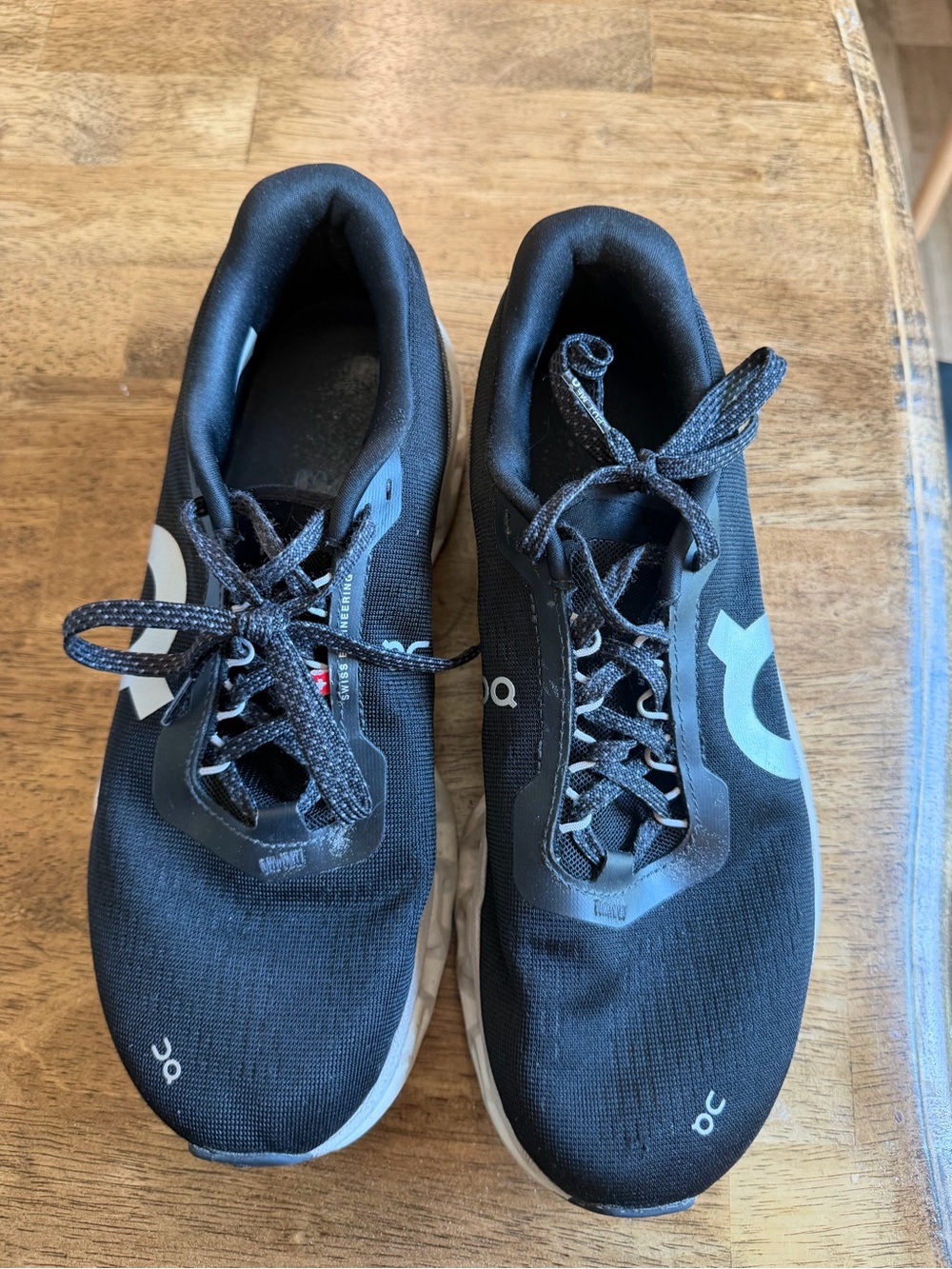 On Running Women's Black Athletic Shoes with Light Blue Accents
